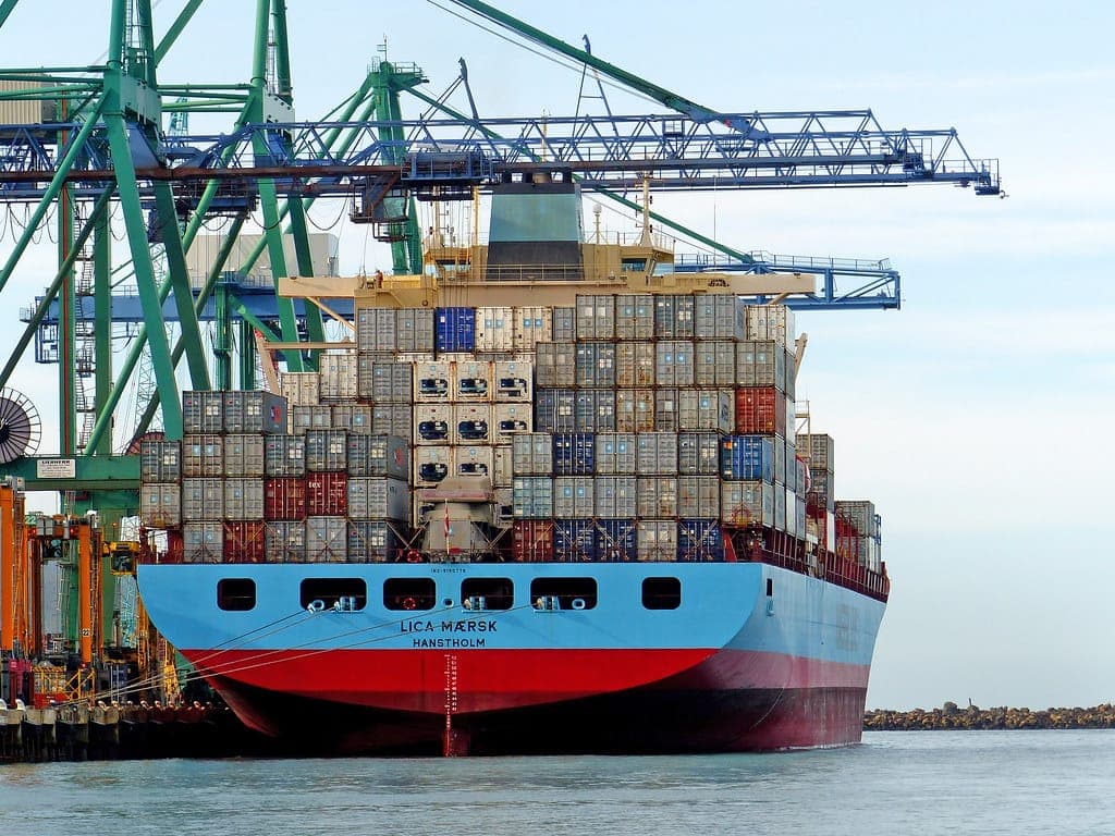 Container ship berthed under gantry cranes at a port terminal